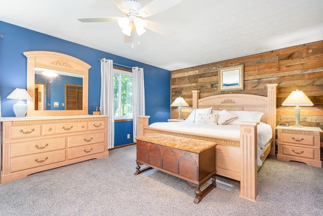 333 Salem Rd, Caledonia, OH 43314 - carpeted bedroom featuring wooden walls and a ceiling fan