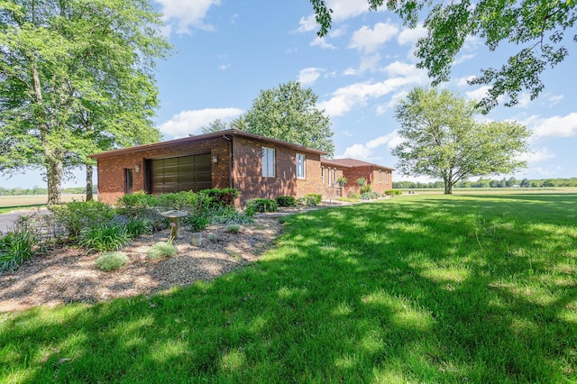 333 Salem Rd, Caledonia, OH 43314 - view of side of home featuring a yard and brick siding