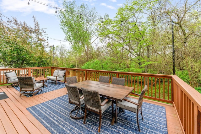 deck with outdoor dining area