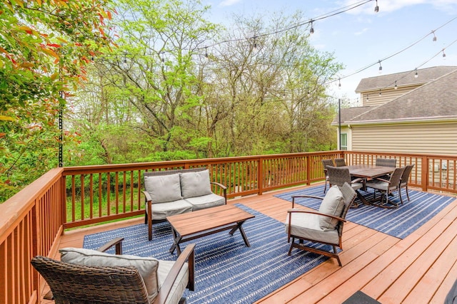 deck featuring an outdoor living space and outdoor dining space