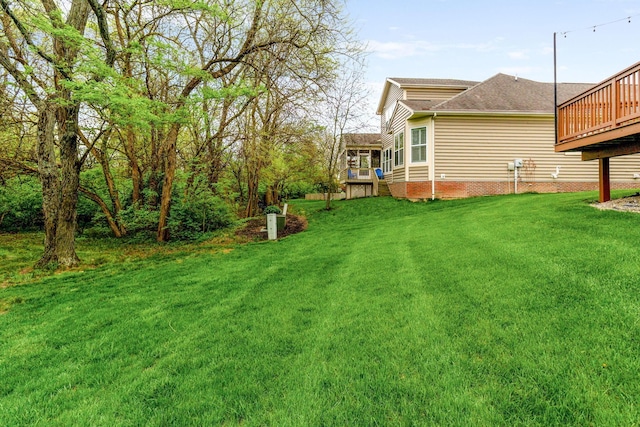 view of yard with a deck