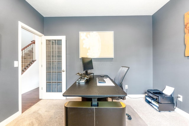 office area featuring carpet floors and baseboards