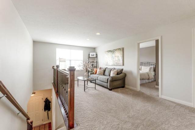 living room featuring baseboards, carpet flooring, and recessed lighting