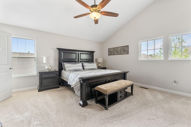 bedroom with baseboards, visible vents, multiple windows, and light colored carpet