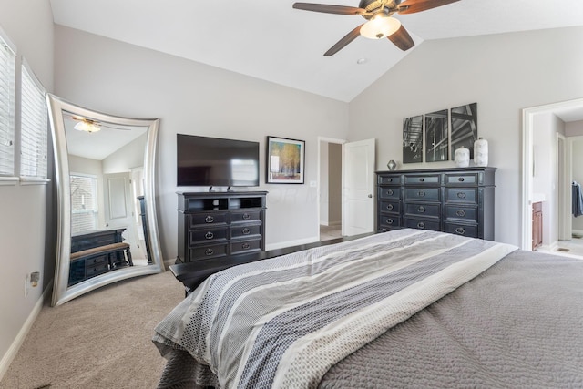 carpeted bedroom featuring baseboards, a ceiling fan, ensuite bath, and lofted ceiling