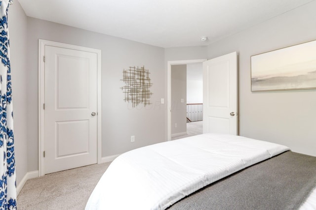 carpeted bedroom with baseboards