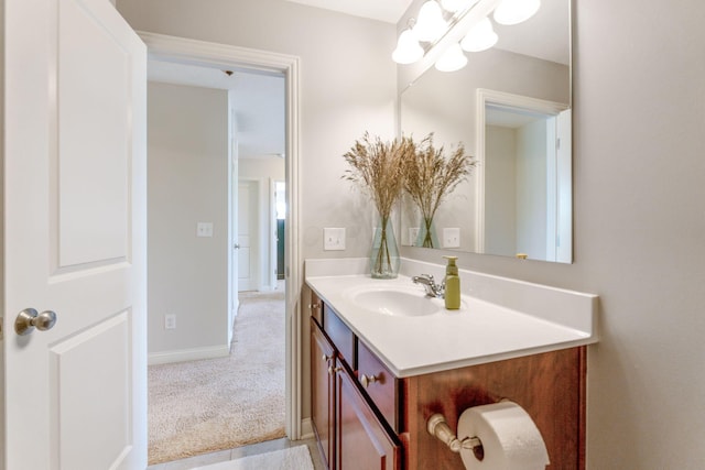 bathroom with baseboards and vanity