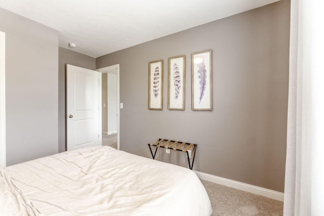 carpeted bedroom with baseboards