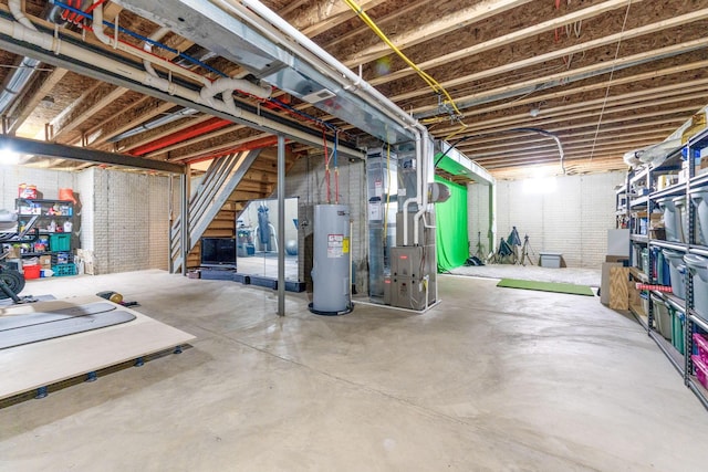unfinished below grade area with heating unit and water heater