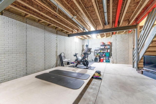 workout room with brick wall
