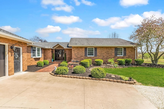 1012 Lake Fork Rd, Utica, OH 43080 - ranch-style home with a shingled roof, brick siding, and a front yard