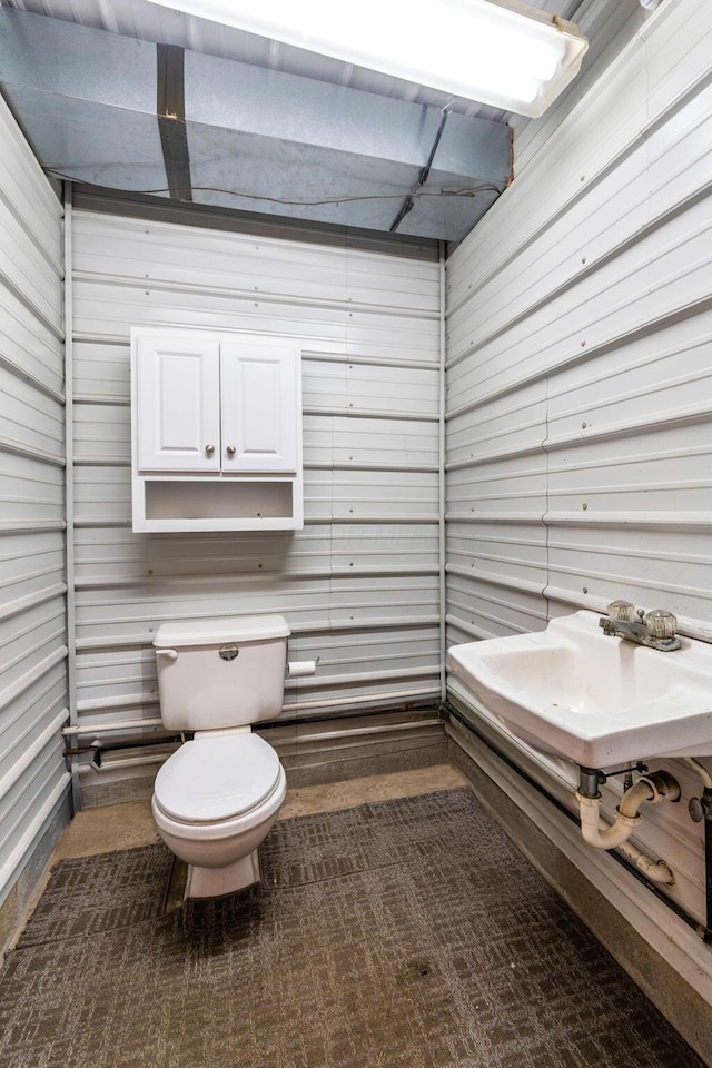 1012 Lake Fork Rd, Utica, OH 43080 - bathroom with wooden walls and toilet