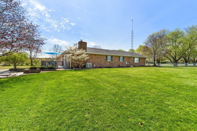 1012 Lake Fork Rd, Utica, OH 43080 - rear view of house with a lawn, brick siding, fence, and a chimney
