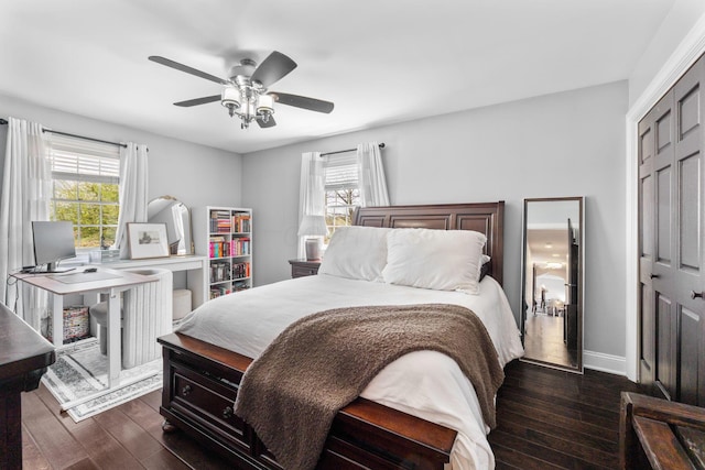1012 Lake Fork Rd, Utica, OH 43080 - bedroom with baseboards, dark wood-style floors, ceiling fan, and a closet