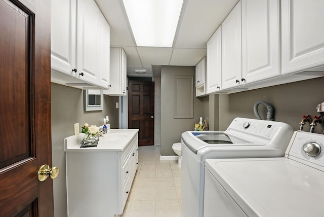 1012 Lake Fork Rd, Utica, OH 43080 - laundry room with laundry area, light tile patterned floors, baseboards, a sink, and washer and dryer