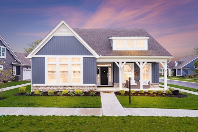 modern farmhouse featuring board and batten siding, central AC, and a front yard