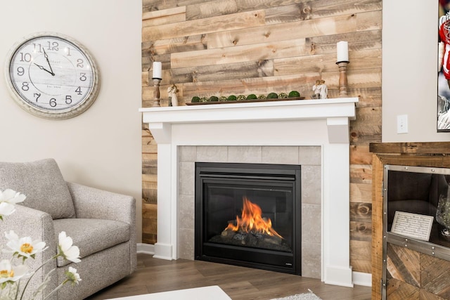 interior details featuring a fireplace and wood finished floors