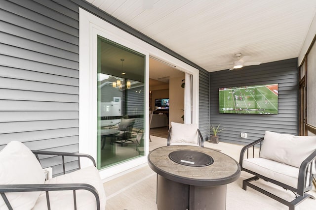 view of patio featuring an outdoor living space with a fire pit and ceiling fan