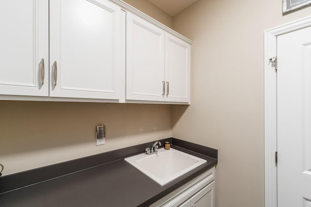 clothes washing area featuring a sink