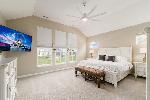 bedroom with light colored carpet, vaulted ceiling, baseboards, and visible vents