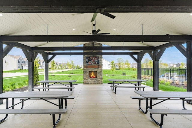 view of home's community with a residential view, fence, a lawn, a gazebo, and a patio area