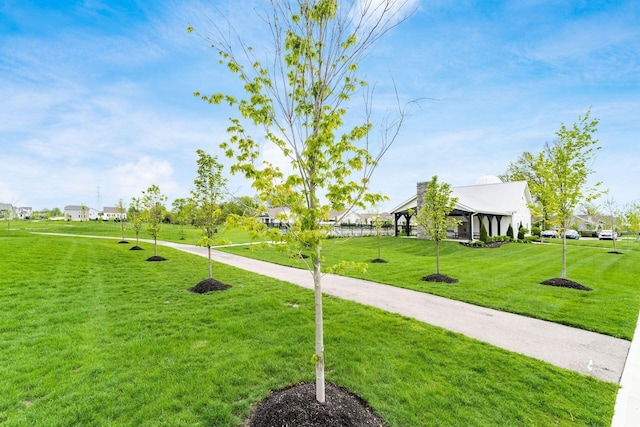 view of property's community with a gazebo and a lawn