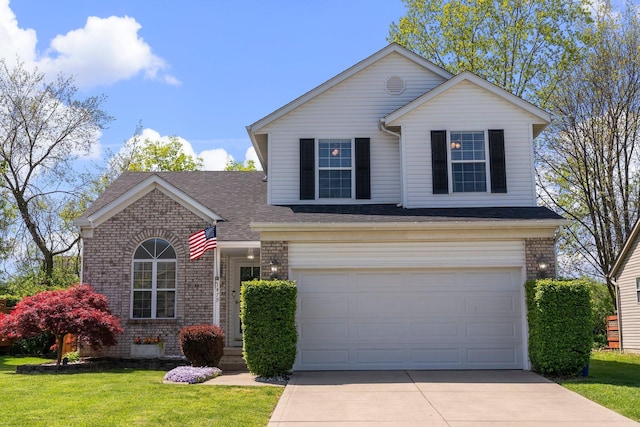 1479 Brookforest Dr, Columbus, OH 43204 - view of front of property with brick siding, a front lawn, an attached garage, and driveway