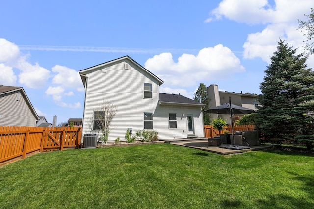 1479 Brookforest Dr, Columbus, OH 43204 - back of house featuring a lawn, cooling unit, and a fenced backyard