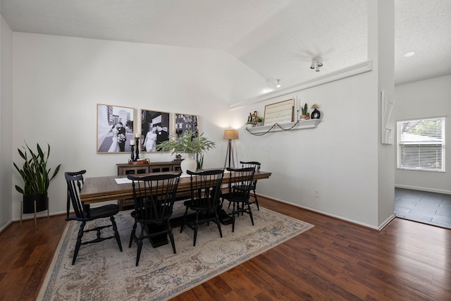 1479 Brookforest Dr, Columbus, OH 43204 - dining area featuring baseboards, wood finished floors, and lofted ceiling