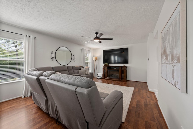 1479 Brookforest Dr, Columbus, OH 43204 - living room with baseboards, dark wood-type flooring, a textured ceiling, and ceiling fan