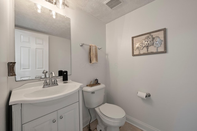 1479 Brookforest Dr, Columbus, OH 43204 - bathroom with visible vents, vanity, toilet, baseboards, and a textured ceiling