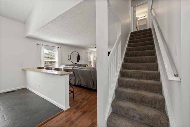 1479 Brookforest Dr, Columbus, OH 43204 - stairway with visible vents, baseboards, a textured ceiling, and wood finished floors