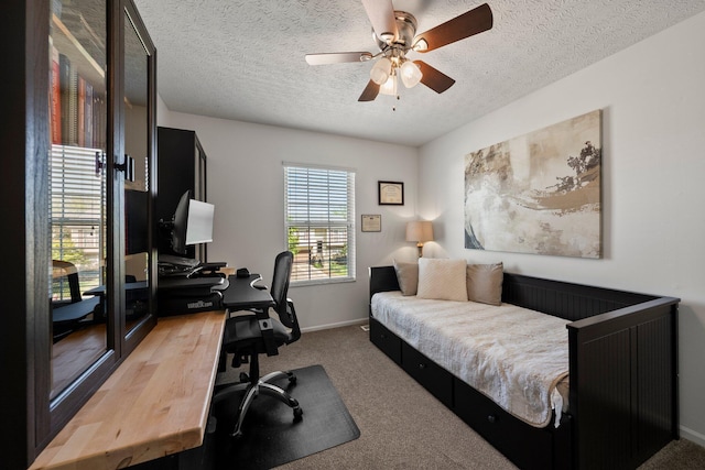 1479 Brookforest Dr, Columbus, OH 43204 - bedroom featuring baseboards, a textured ceiling, ceiling fan, and carpet floors