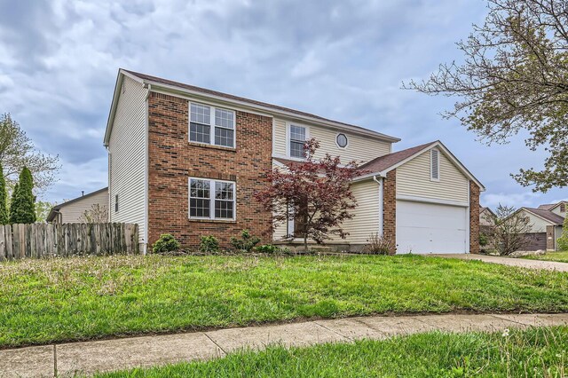3861 Trestle Ct, Columbus, OH 43204 - traditional home with an attached garage, brick siding, and concrete driveway