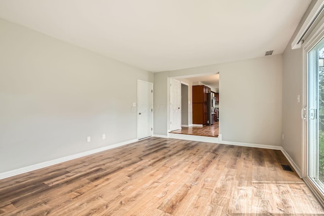 3861 Trestle Ct, Columbus, OH 43204 - spare room with light wood-style floors and baseboards