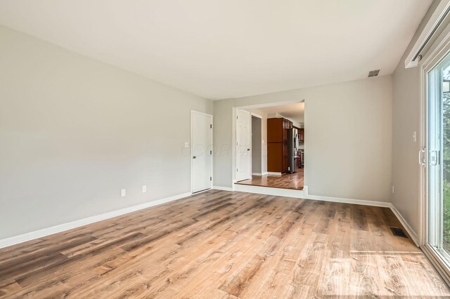 3861 Trestle Ct, Columbus, OH 43204 - spare room with light wood-style floors and baseboards