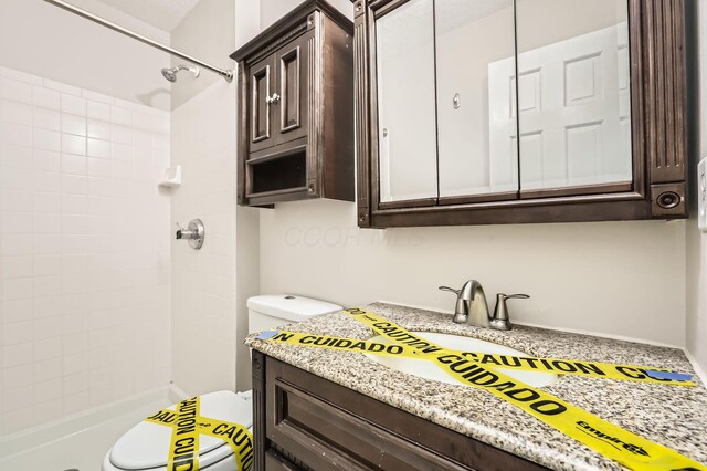 3861 Trestle Ct, Columbus, OH 43204 - full bathroom with toilet, a tile shower, and vanity