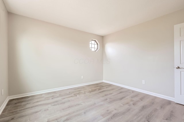 3861 Trestle Ct, Columbus, OH 43204 - empty room featuring light wood-style flooring and baseboards