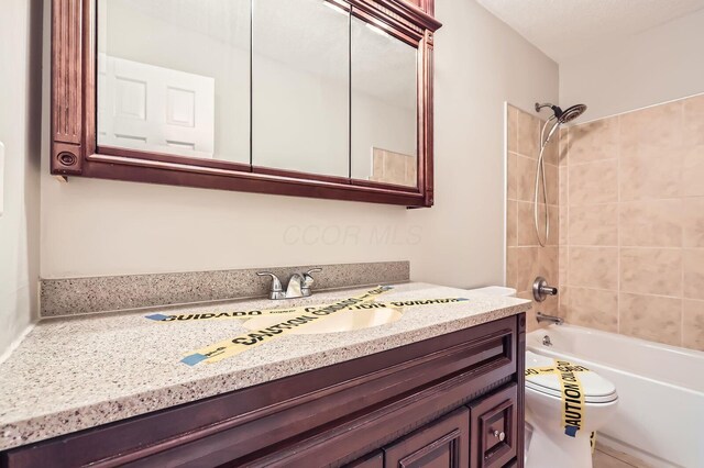 3861 Trestle Ct, Columbus, OH 43204 - bathroom with toilet, vanity, and shower / tub combination