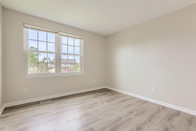3861 Trestle Ct, Columbus, OH 43204 - spare room with wood finished floors and baseboards