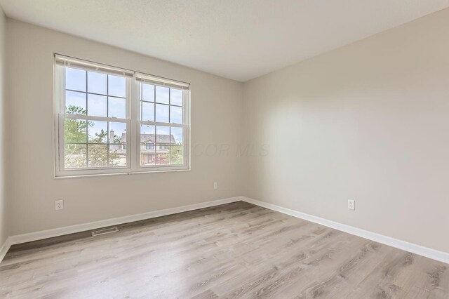 3861 Trestle Ct, Columbus, OH 43204 - spare room with wood finished floors and baseboards