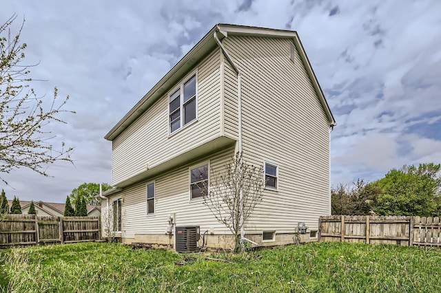 3861 Trestle Ct, Columbus, OH 43204 - view of side of home featuring central AC unit and fence