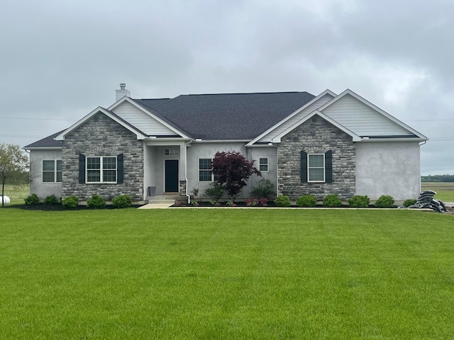view of front of home with a chimney, stucco siding, a front yard, and stone siding