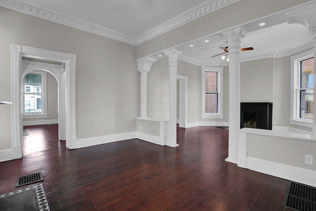 unfurnished living room featuring visible vents, ceiling fan, and hardwood / wood-style floors