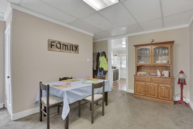 1227 E Chestnut St, Lancaster, OH 43130 - dining room with baseboards, light colored carpet, a drop ceiling, and ornamental molding