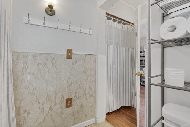 1227 E Chestnut St, Lancaster, OH 43130 - bathroom featuring a wainscoted wall, toilet, and wood finished floors