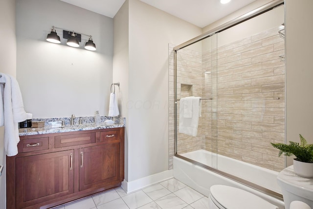 full bath featuring toilet, baseboards, shower / bath combination with glass door, and vanity
