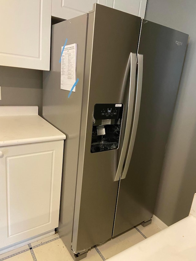 4670 Shalers Dr Unit 49A, Columbus, OH 43228 - kitchen view of stainless steel refrigerator with ice dispenser, white cabinetry, and light countertops