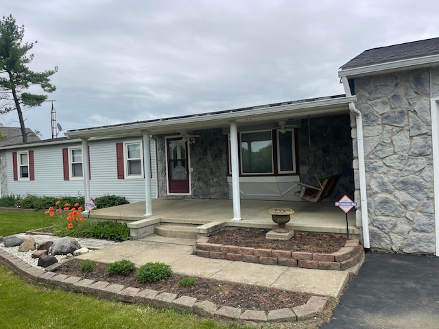10519 Darby Creek Rd, Orient, OH 43146 - view of front facade with stone siding and a porch