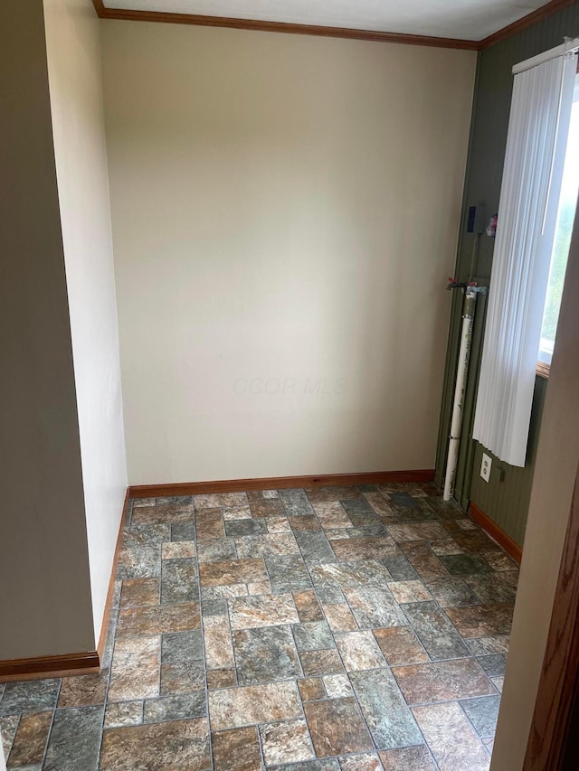 10519 Darby Creek Rd, Orient, OH 43146 - unfurnished room with baseboards, stone tile flooring, and ornamental molding